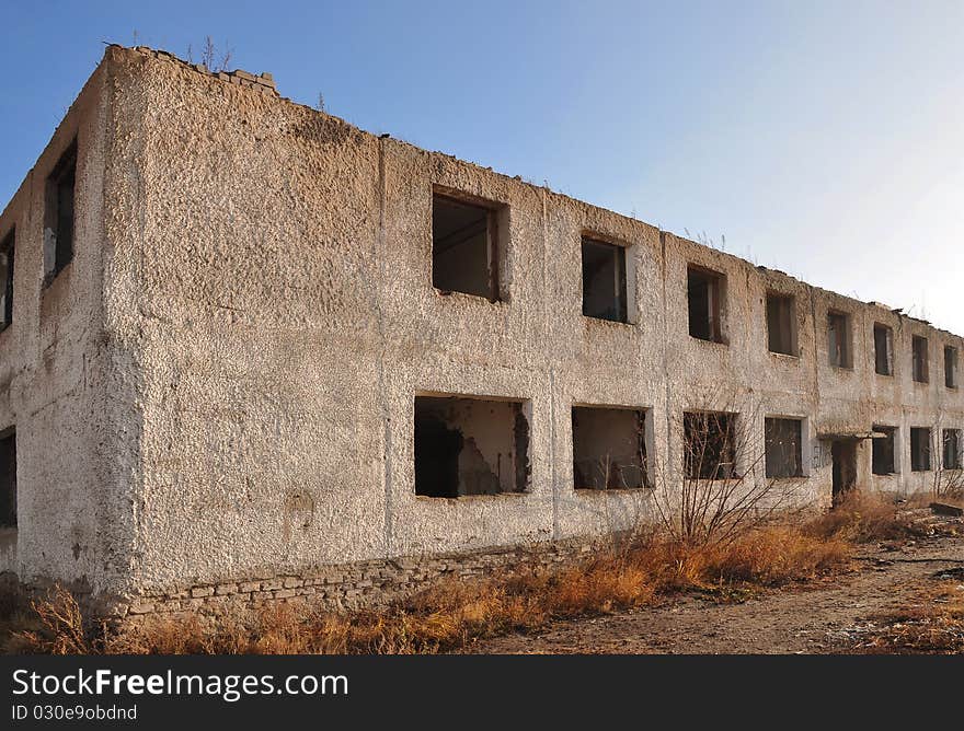 Demolished block of flats against blue sky. Demolished block of flats against blue sky