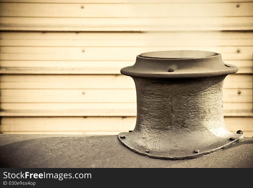 Steam escaping from the funnel of a vintage railroad engine