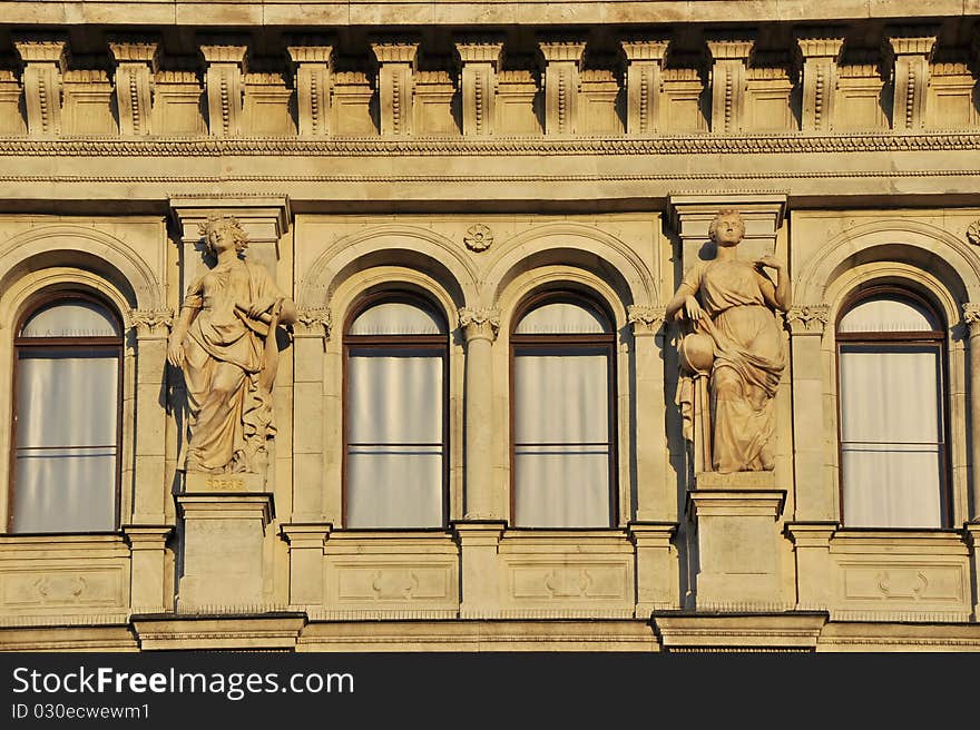 Windows with statues in the sunset