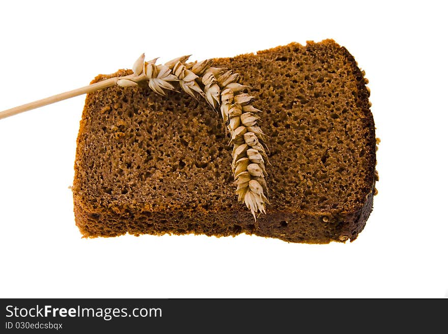 Bread slice on which wheat ear lies. Bread slice on which wheat ear lies