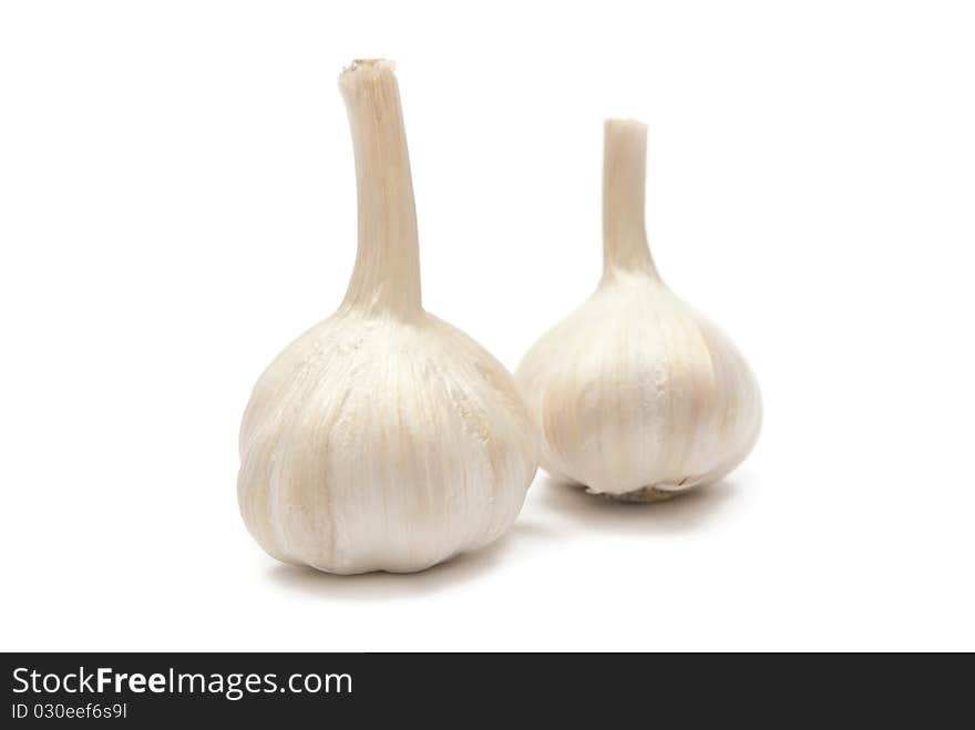 Close-up of two garlics isolated on white