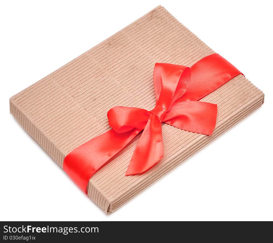 Gift box and red ribbon isolated on white background