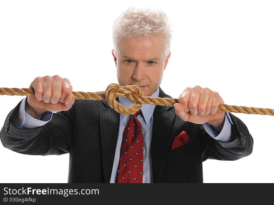 Businessman Pulling A Rope