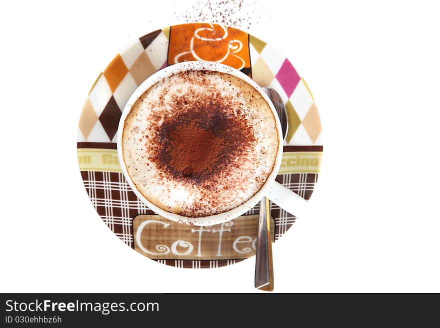 A cup of cappucino viewed from the top on a white background. A cup of cappucino viewed from the top on a white background.