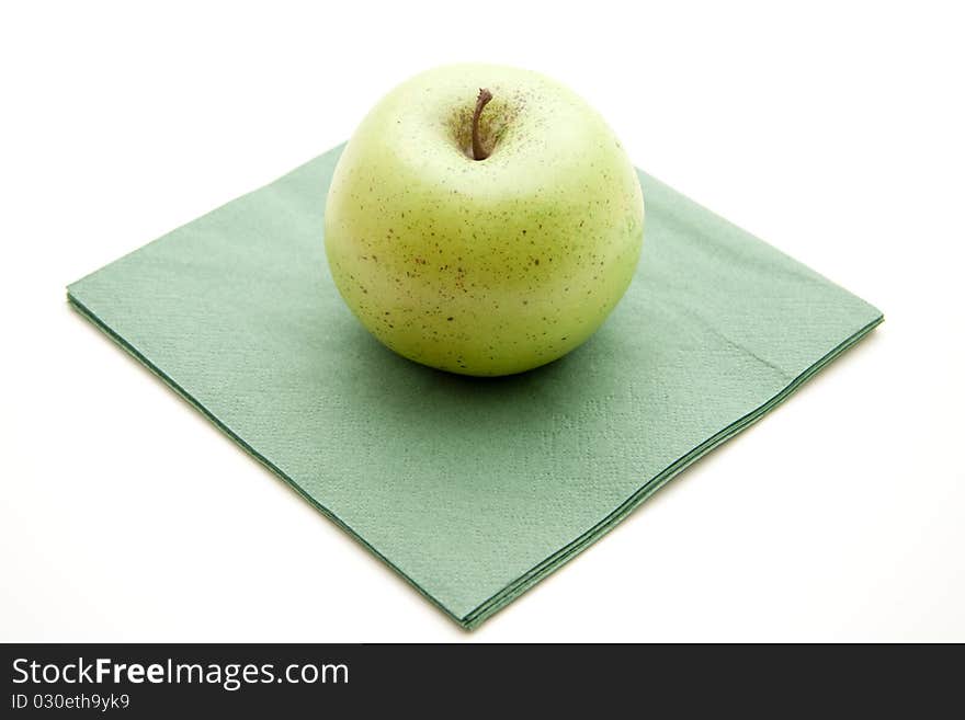 Green apple with napkin