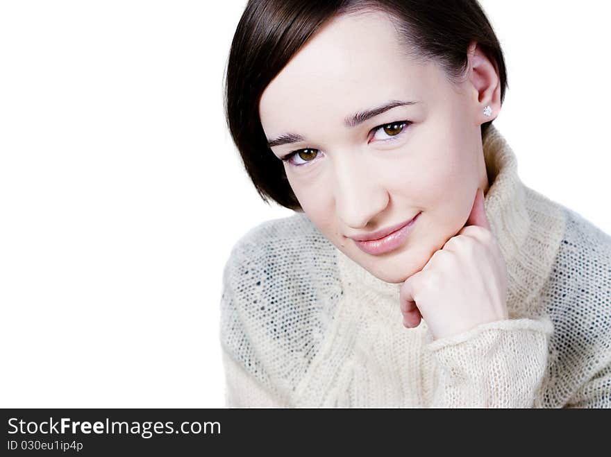 Beautiful girl in white sweater isolated