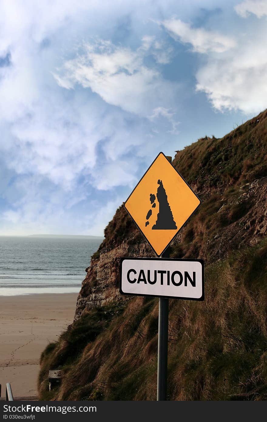 Beach landslide caution sign