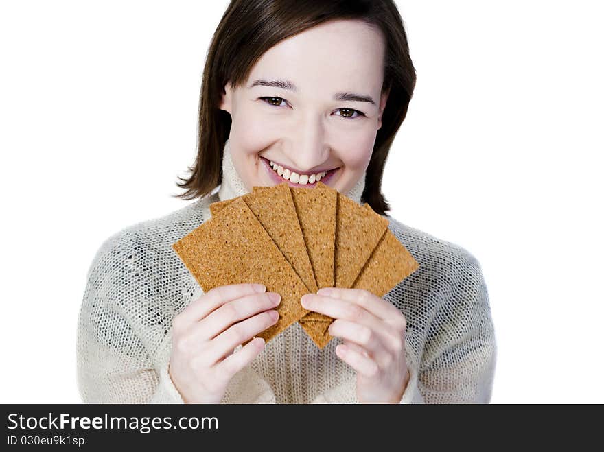 Smiling girl holding bread crisps isolated