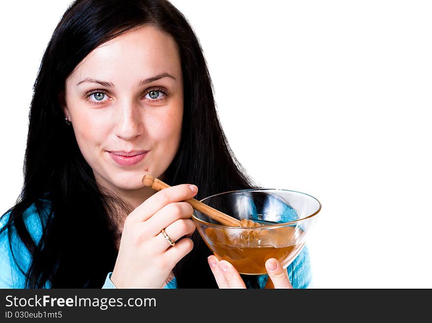 Girl holding honey bowl isolated