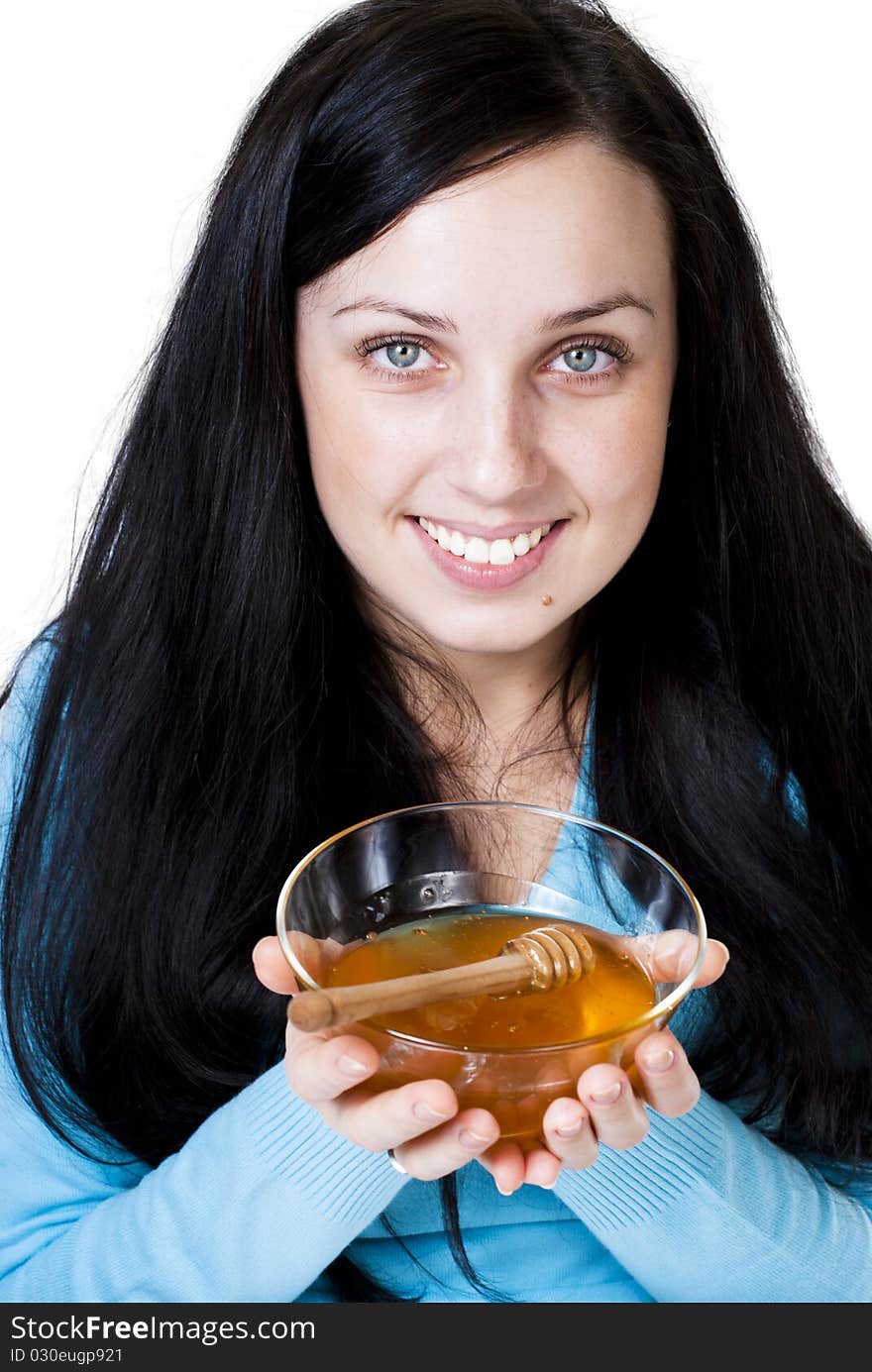 Girl holding honey bowl isolated