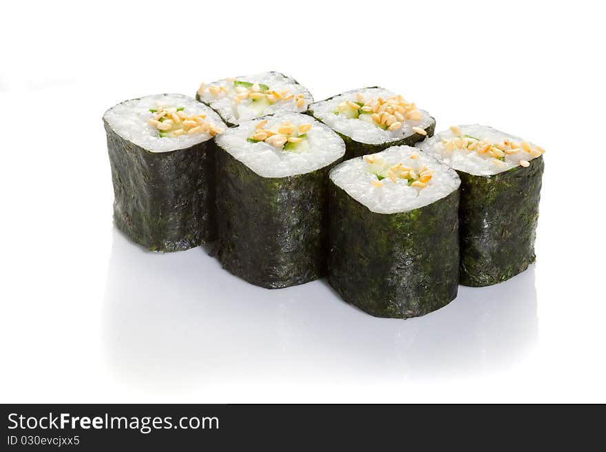 Cucumber maki with sesame topping on white ground