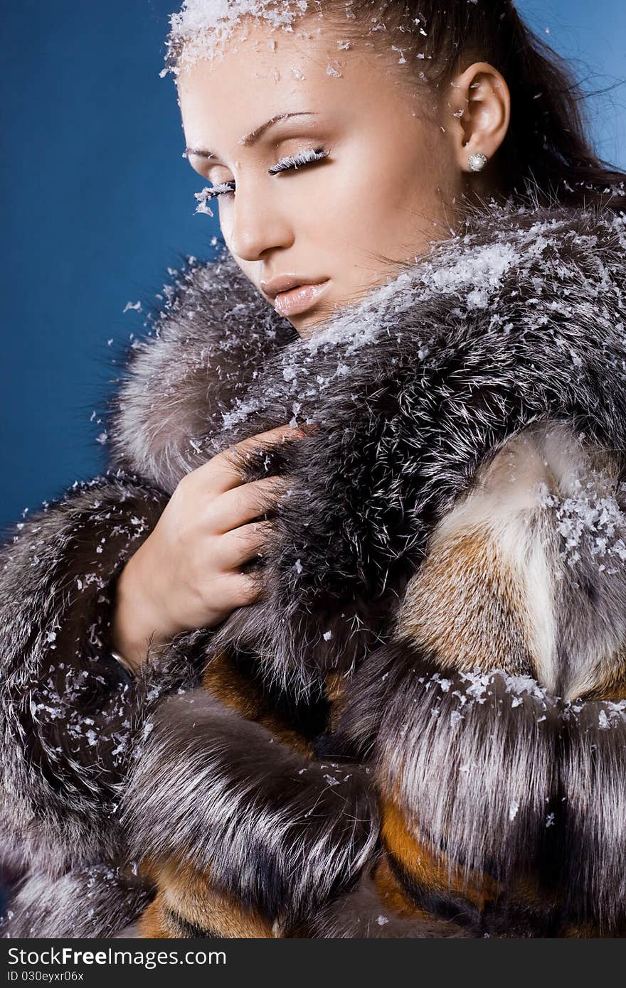 Beautiful woman in a fur coat