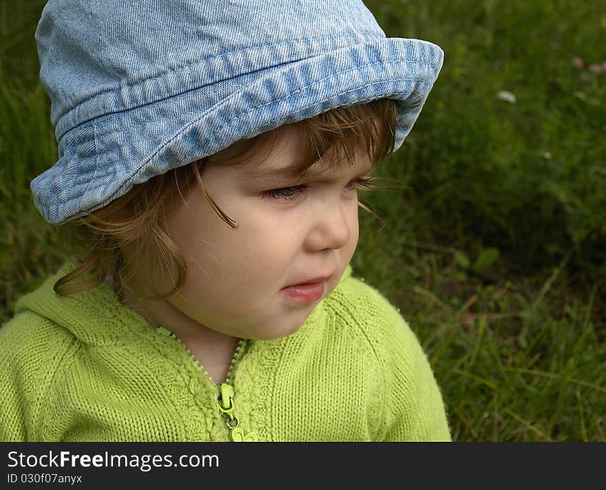 A portrait of a serious pretty little girl