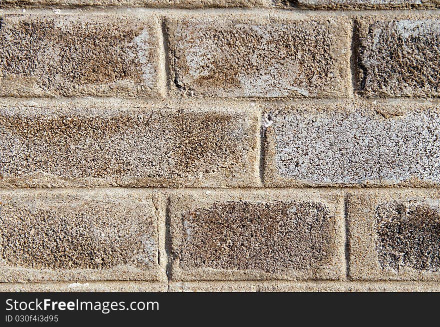 A detailed view of an old grey brick wall. A detailed view of an old grey brick wall.