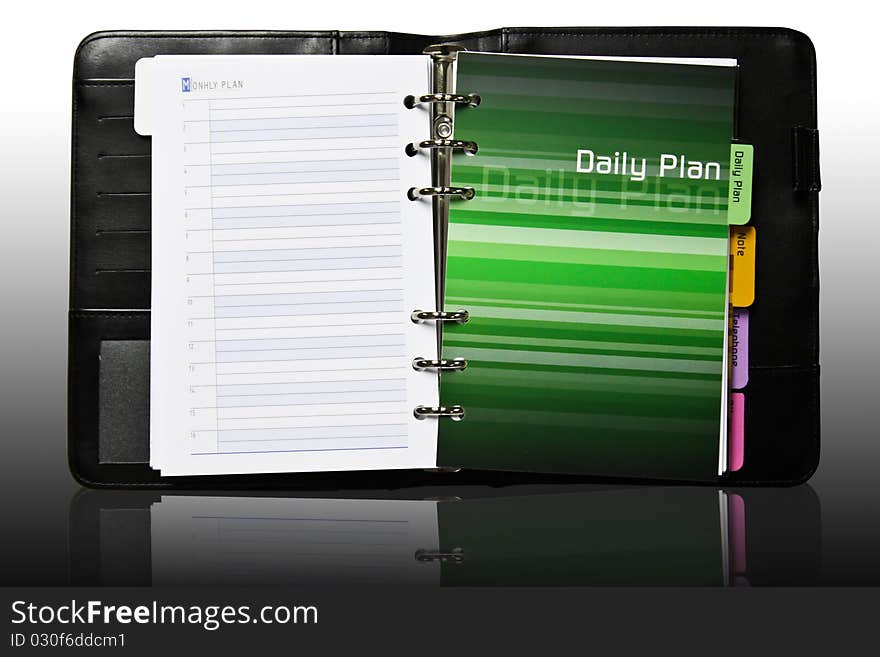 Notebook daily plan page with reflection