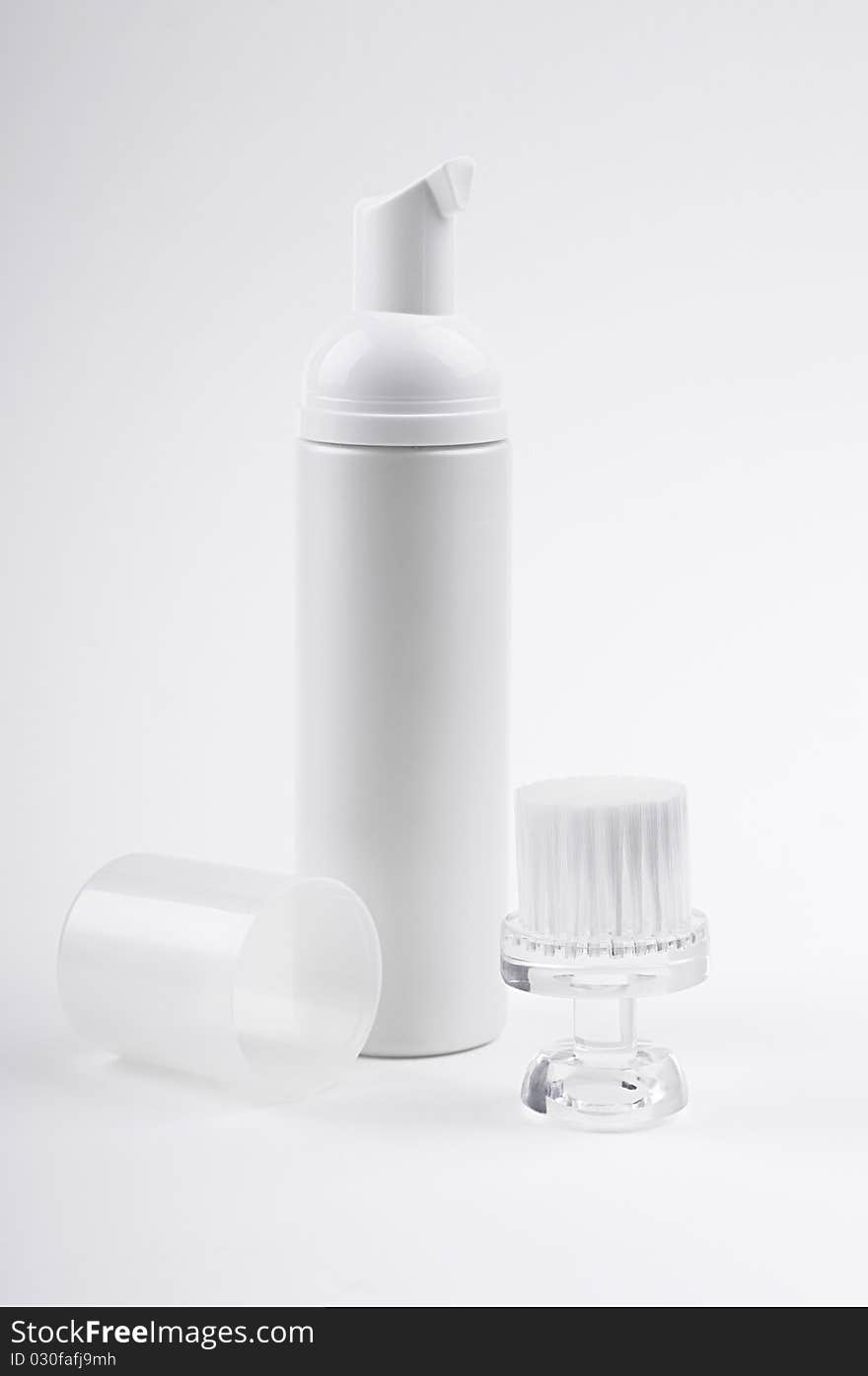 Cosmetic bottle and brush for face cleaning. Cosmetic bottle and brush for face cleaning.