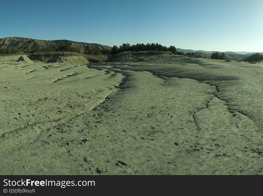 The Berca Mud Volcanoes are a geological and botanical reservation located in the Berca commune in the Buzău County in Romania. Its most spectacular feature is the mud volcanoes, small volcano-shaped structures typically a few meters high caused by the eruption of mud and natural gases. The Berca Mud Volcanoes are a geological and botanical reservation located in the Berca commune in the Buzău County in Romania. Its most spectacular feature is the mud volcanoes, small volcano-shaped structures typically a few meters high caused by the eruption of mud and natural gases.