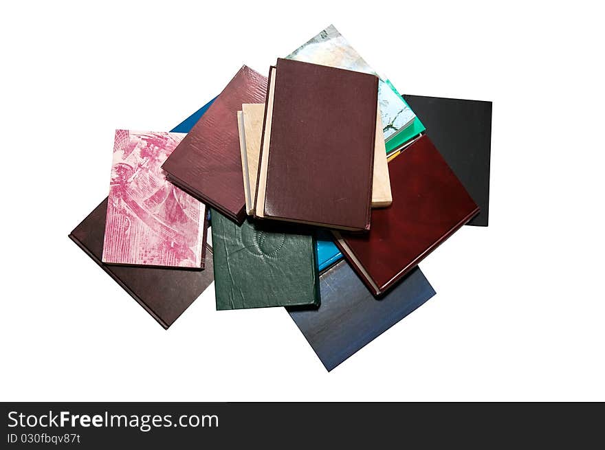 Books lined one over the other on a white background