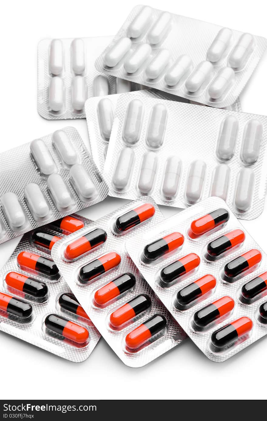 Heap of pills on a white background. Heap of pills on a white background