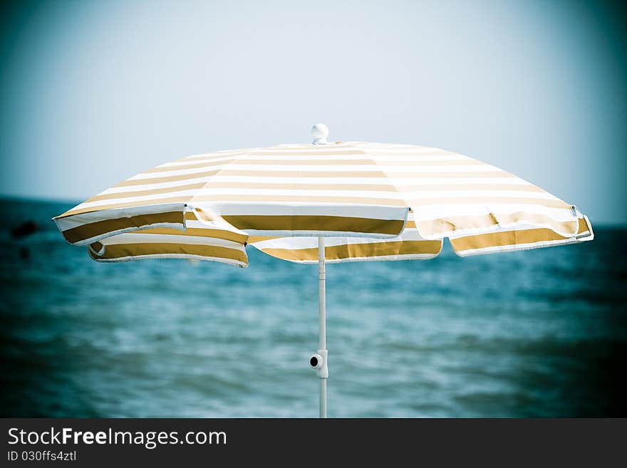 Colorful beach umbrella protecting of sun light