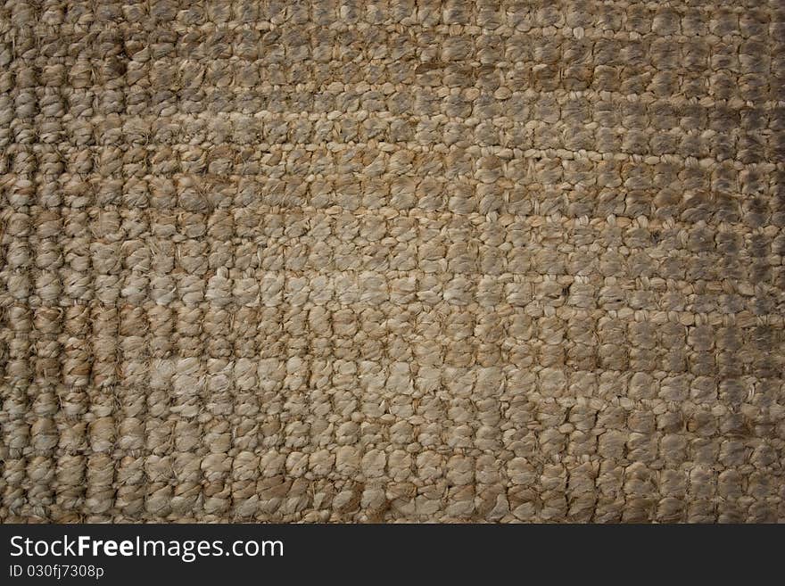 Close-up of used and worn straw door mat. Close-up of used and worn straw door mat.