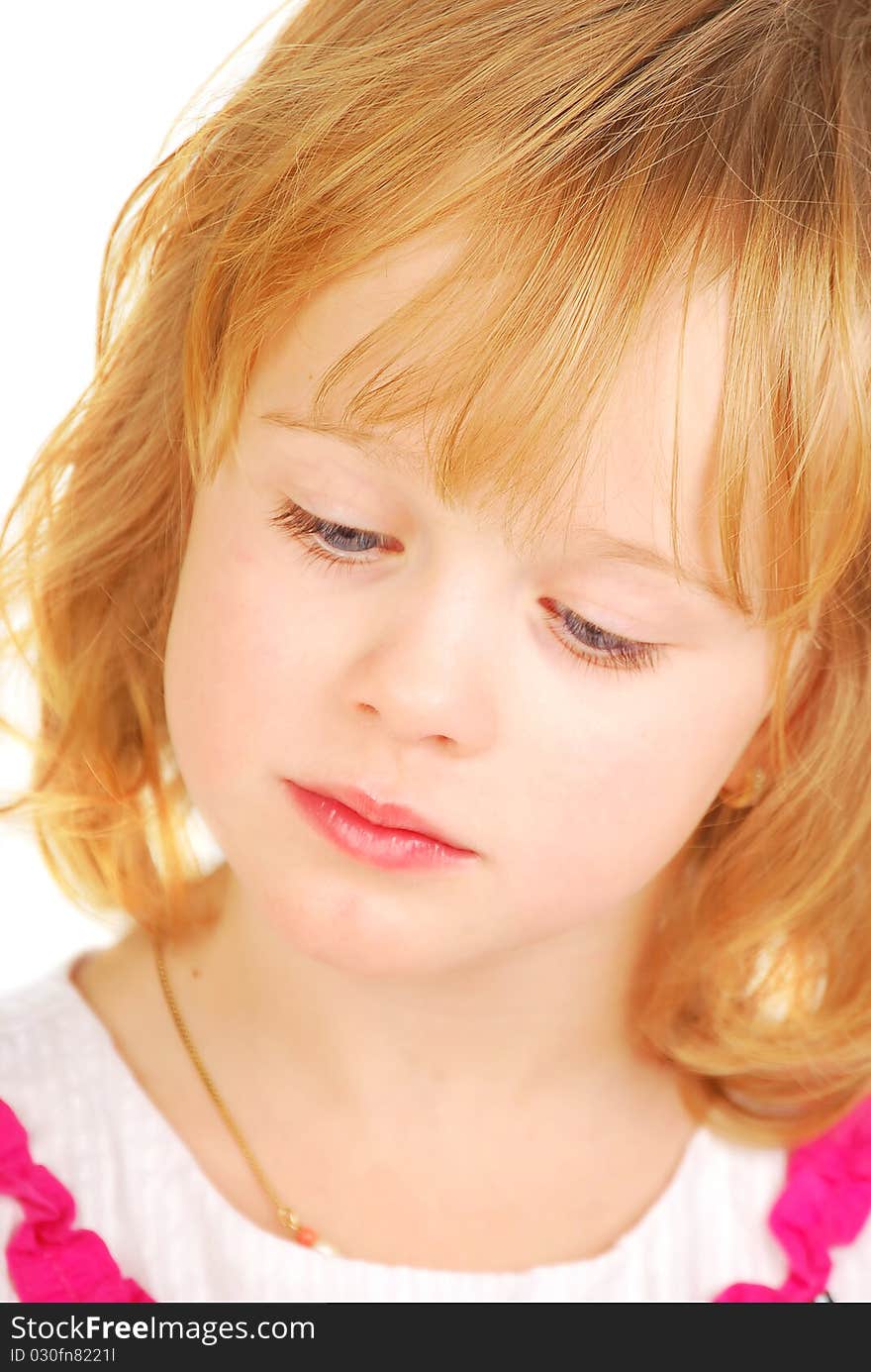 Portrait for little sad or reading girl isolated on the white background. Studio Shoot. Portrait for little sad or reading girl isolated on the white background. Studio Shoot.