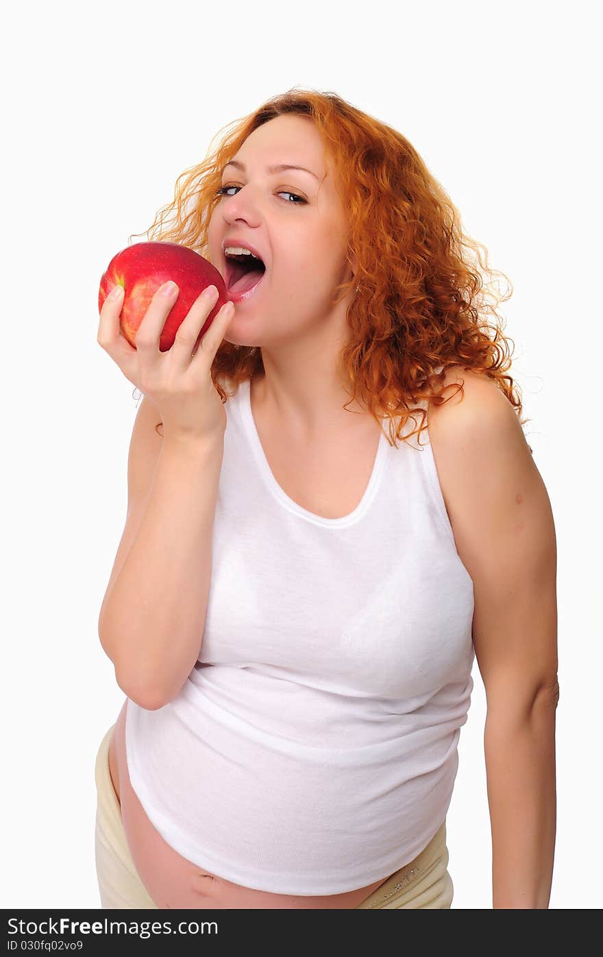 Young redhead pregnant mom thinks about healthy food