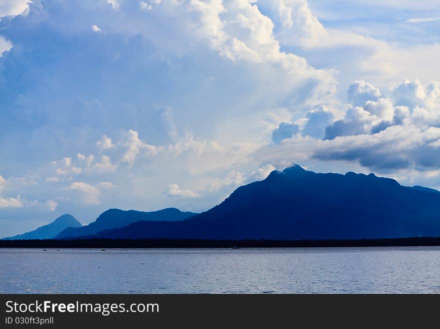 Hills In The Morning At A Lake