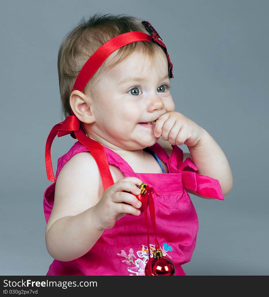 Little girl is seating and posing