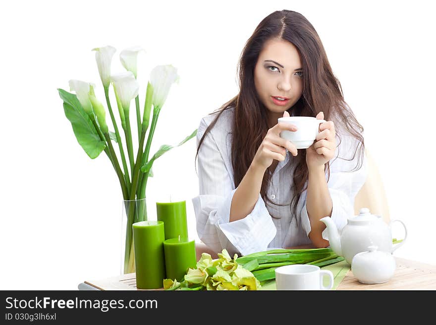 Woman dirinking tea smiling and looking at camera wearing formal clothes. Woman dirinking tea smiling and looking at camera wearing formal clothes