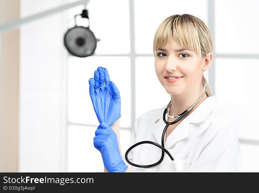 Woman doctor with blond hair in white. Woman doctor with blond hair in white