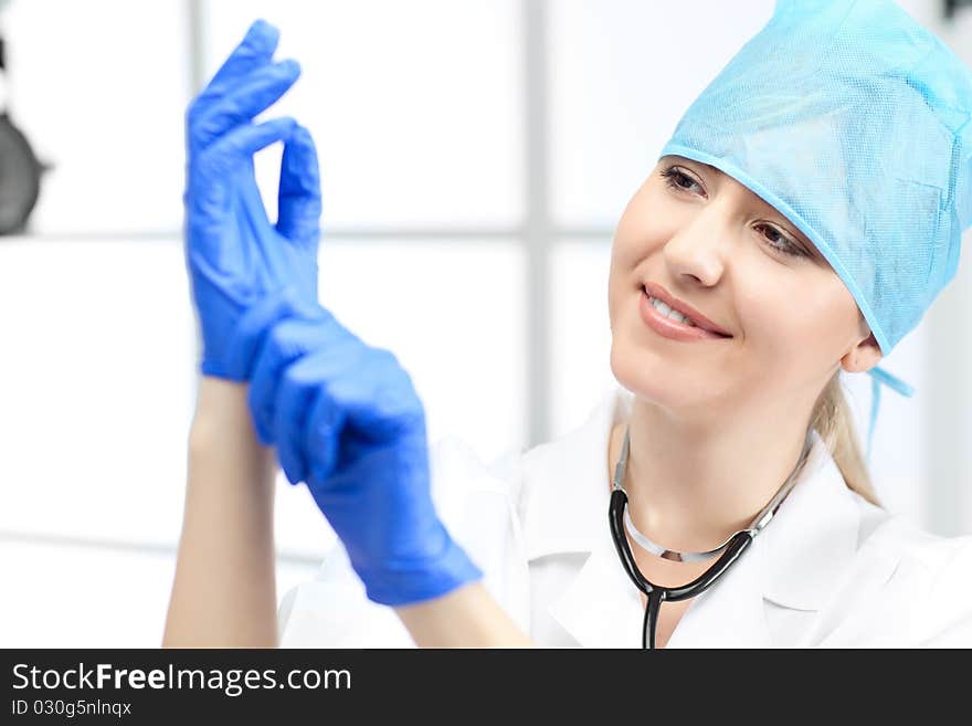 Woman doctor with blond hair in white. Woman doctor with blond hair in white