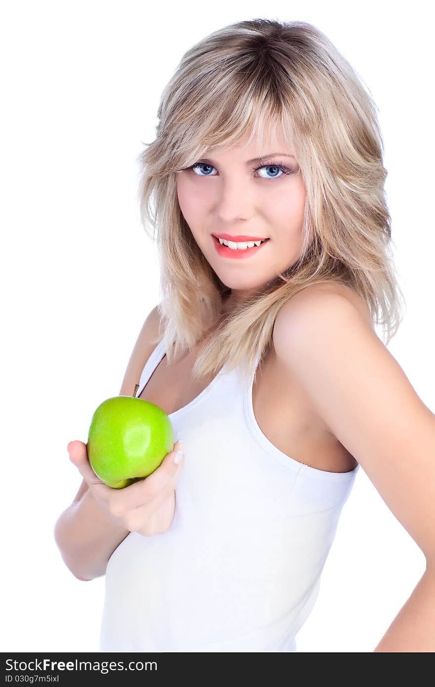 Young girl over white background with apple. Young girl over white background with apple