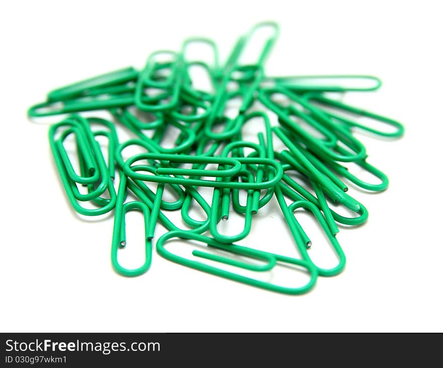 Color paper clips to background. Isolated on white background