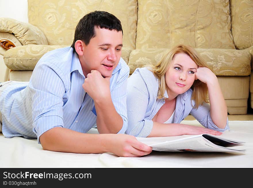 A young couple spends time together in the interior