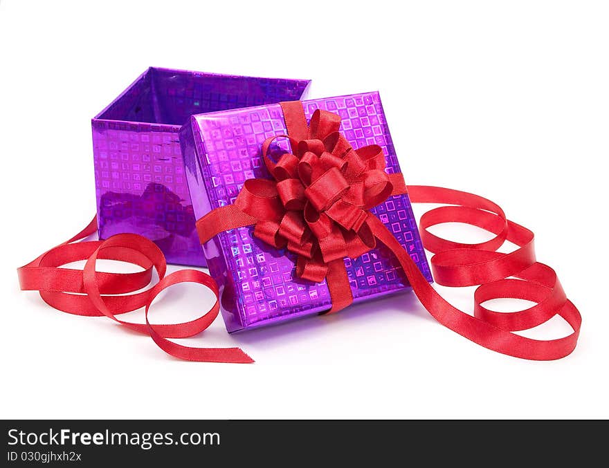 Gift box with red bow on white