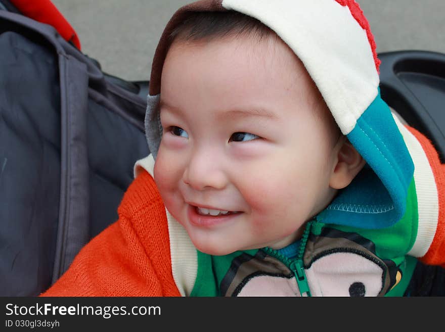 Smiling baby in the winter day