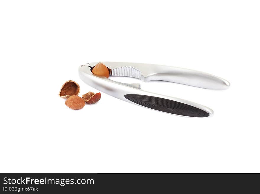 Walnut in a nutcracker on white background