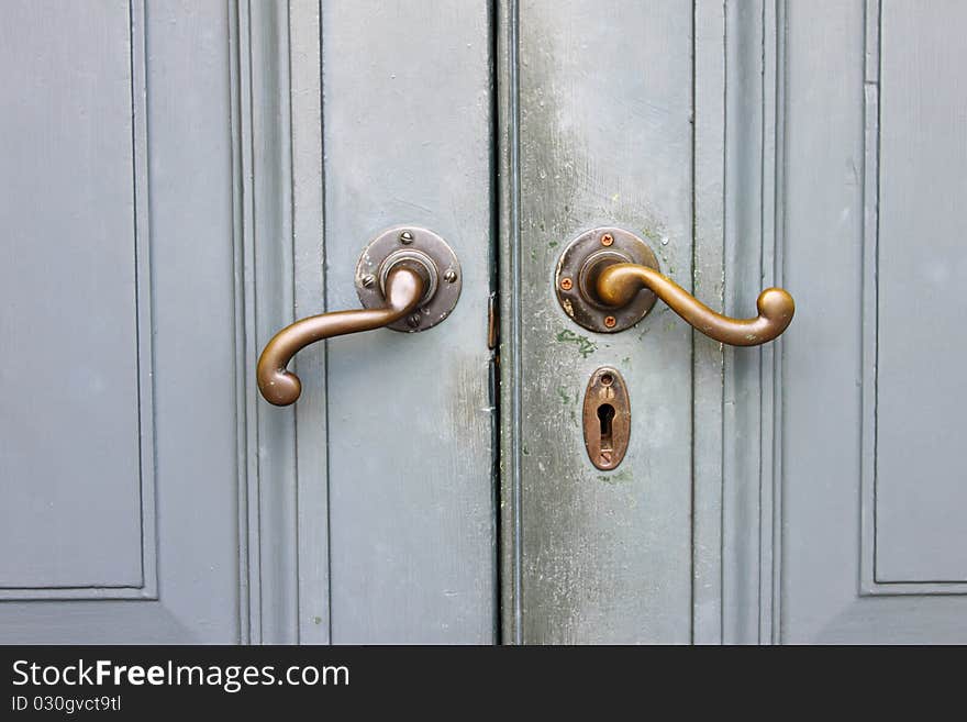 A door knob on blue door.