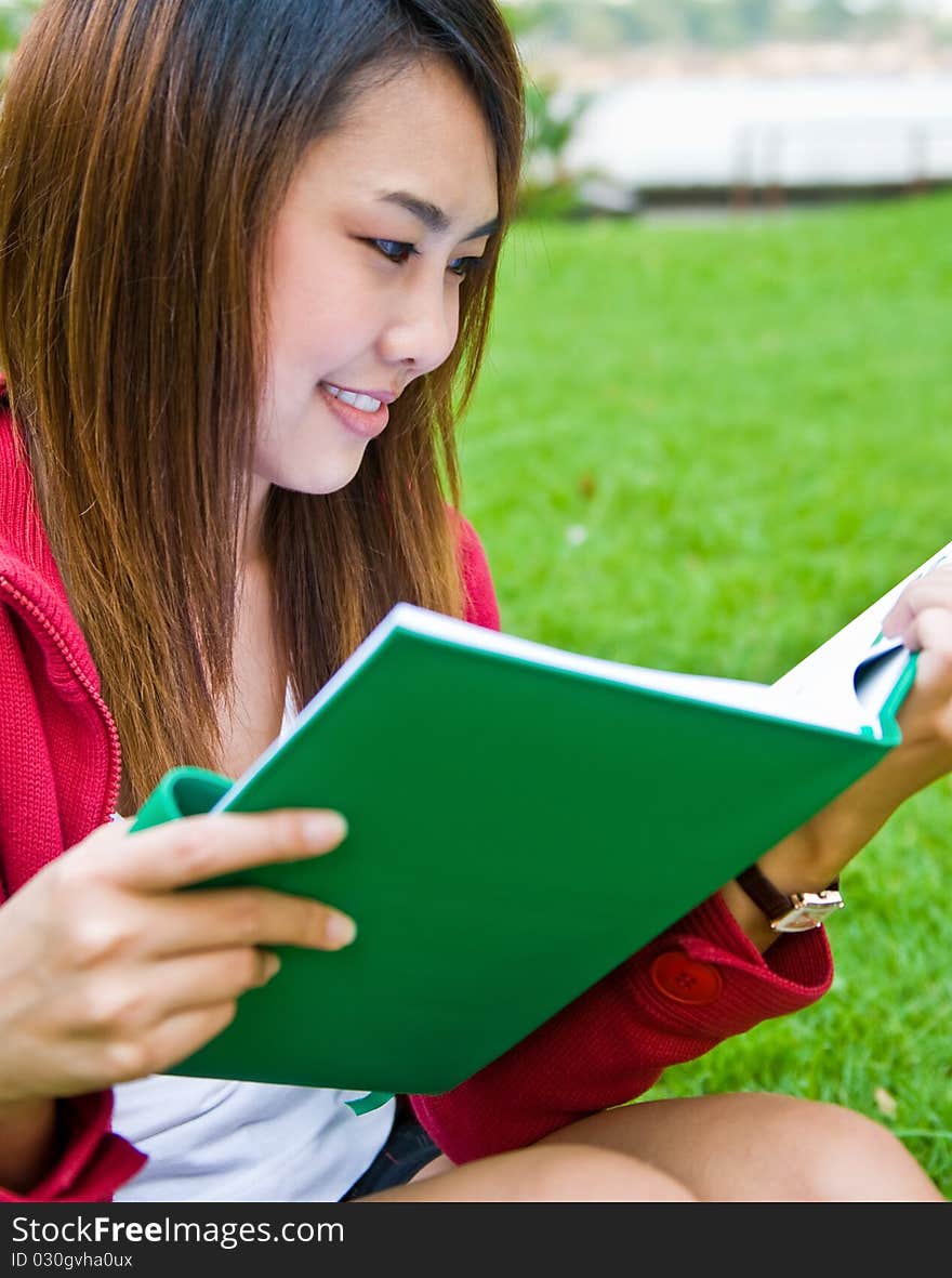 Portrait of the young beautiful with the book