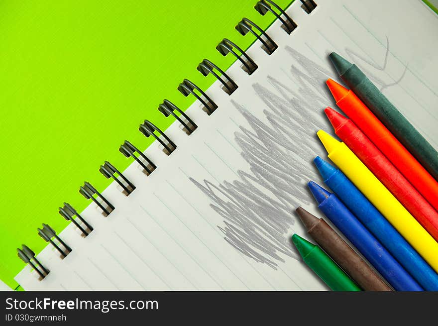 Isolated green notebook on white.