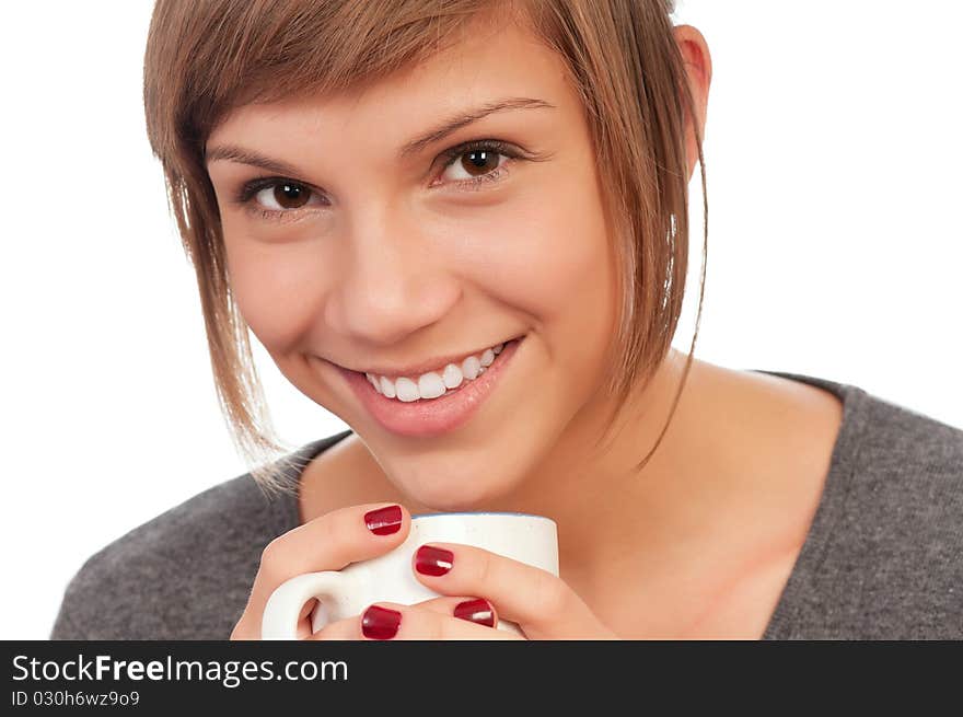 Portrait of a happy beautiful teenage girl holding a cup. Portrait of a happy beautiful teenage girl holding a cup