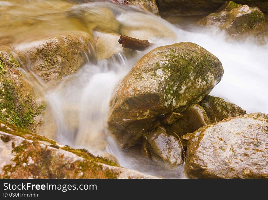 Closeup view of pebble and stream