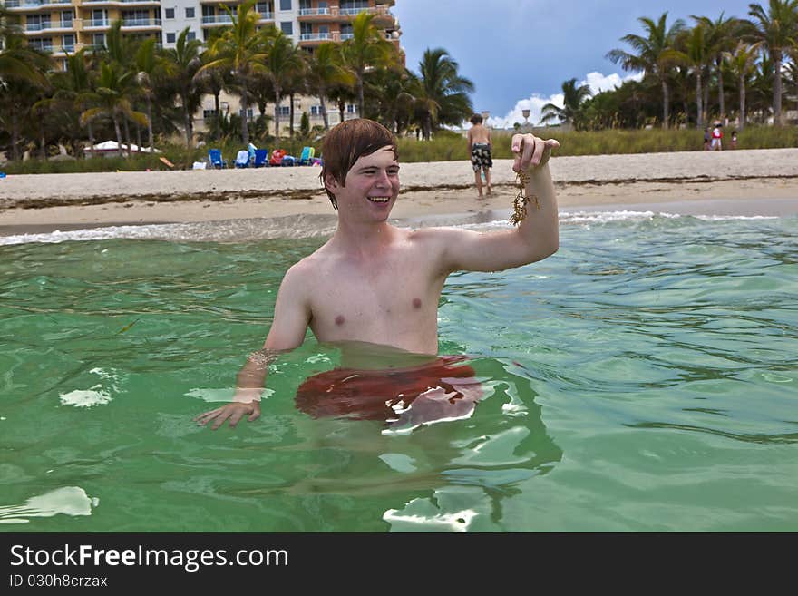 Cute boy is swimming in the ocean. Cute boy is swimming in the ocean