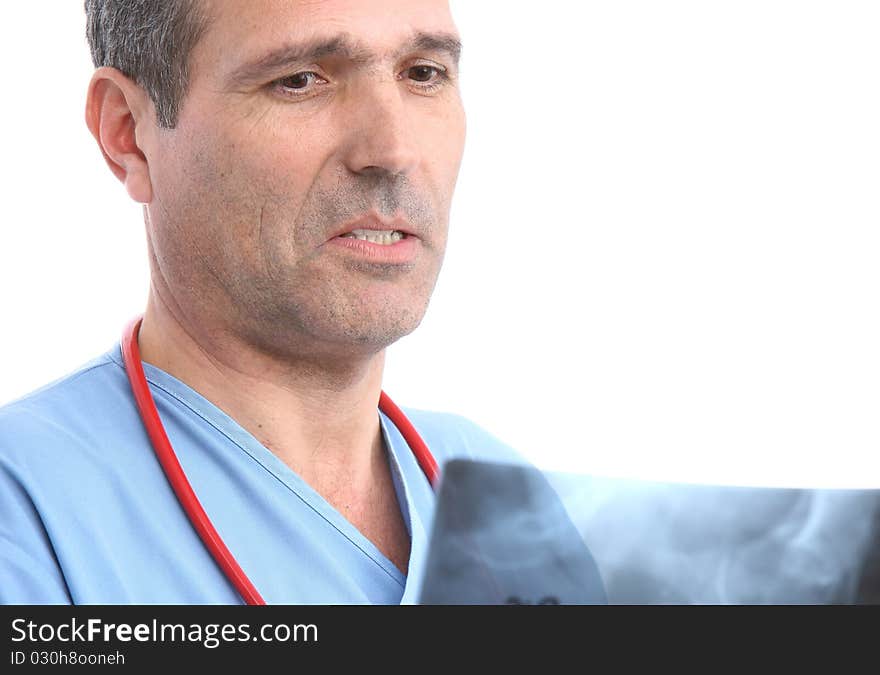 Doctor looking at a xray in a white background