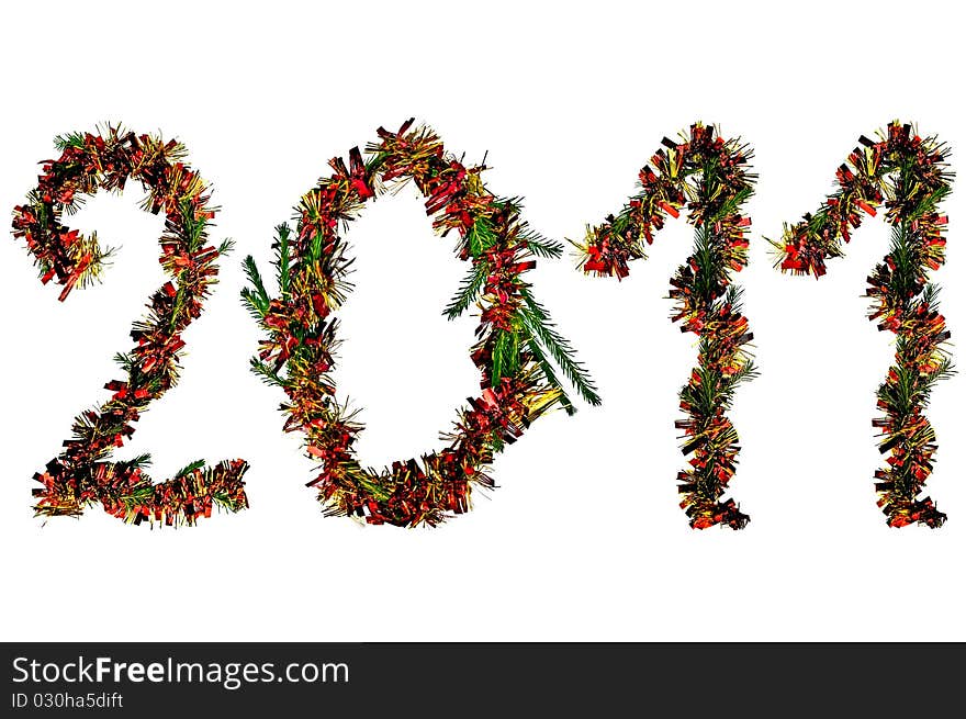 The number of two thousand and eleven of fir branches, red and gold tinsel isolated on a white background. The number of two thousand and eleven of fir branches, red and gold tinsel isolated on a white background