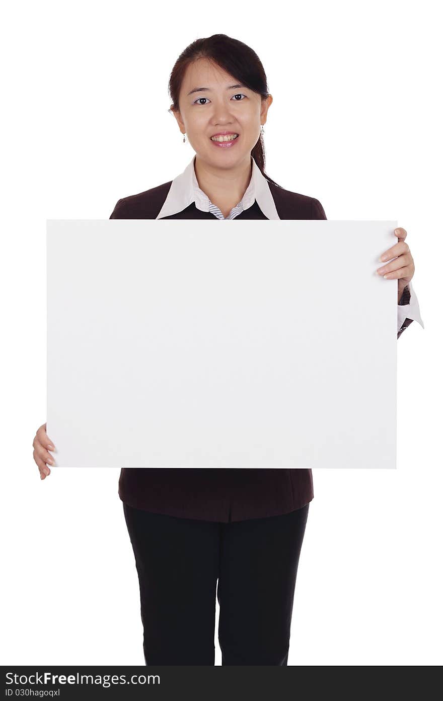 An Asian businesswoman holding a blank placard. An Asian businesswoman holding a blank placard