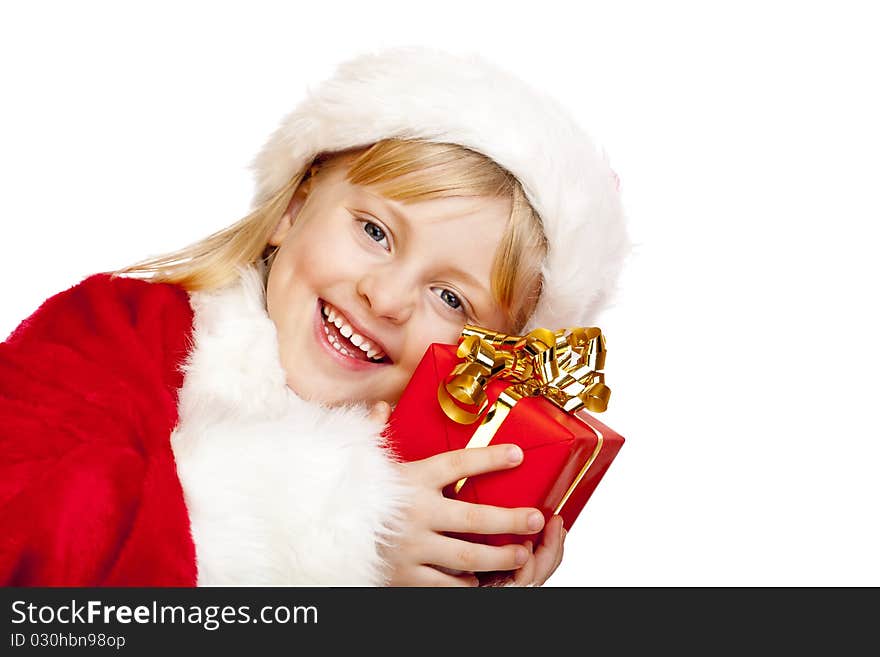 Young santa claus girl holds christmas gift