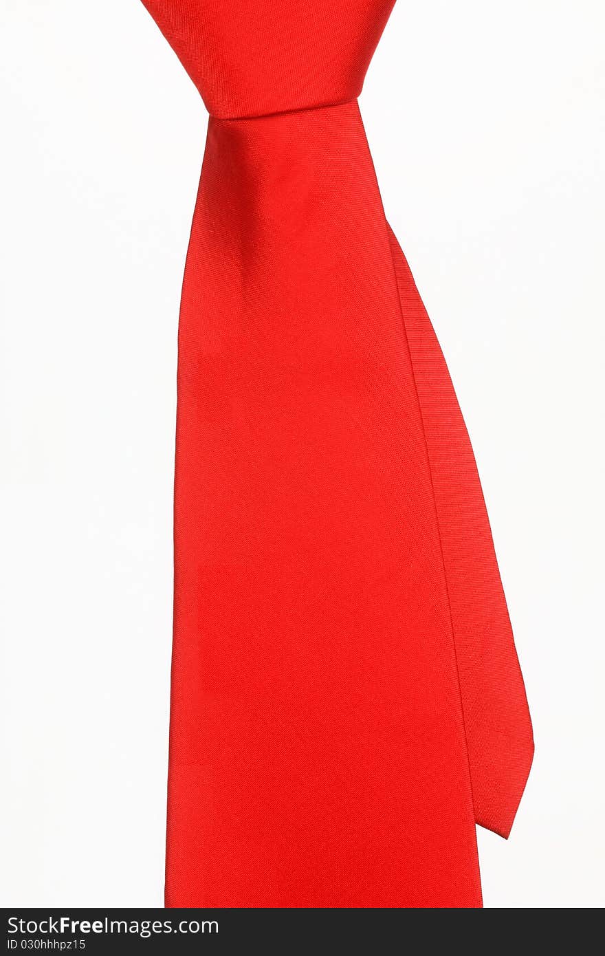 Bright red tie on a white background