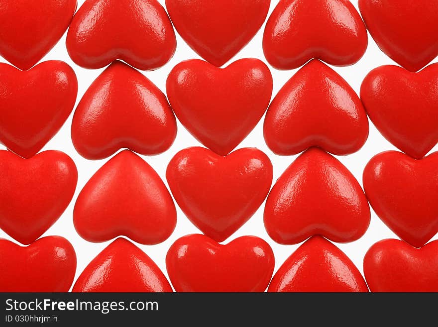 Abstract picture from red hearts on a white background